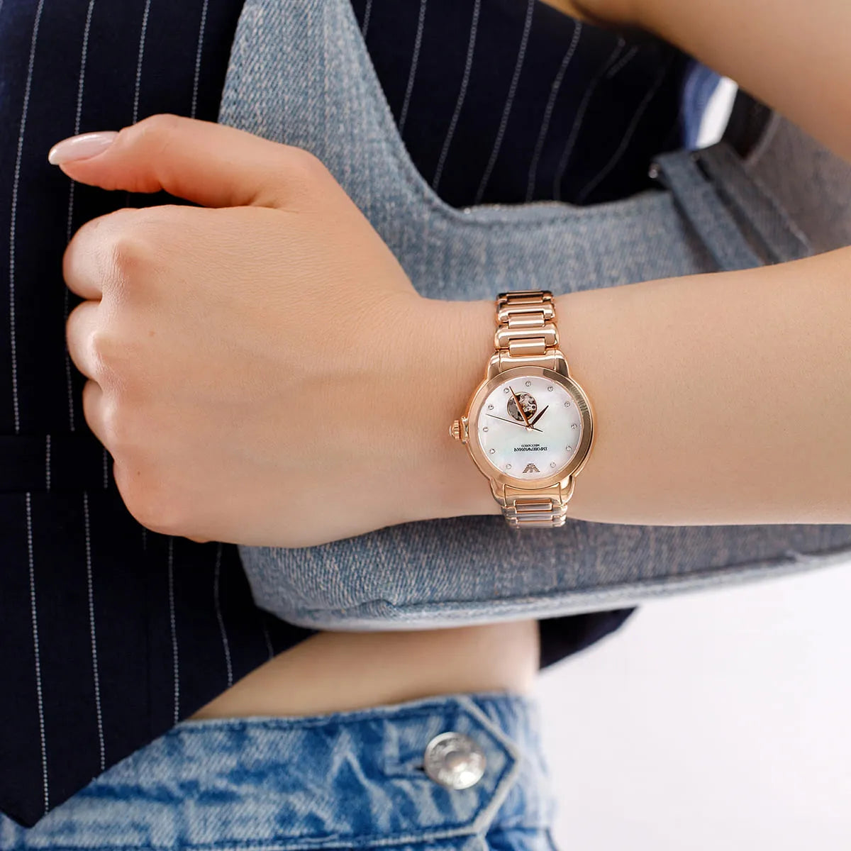 Emporio Armani Mia automatic watch worn on wrist with rose-gold metal bracelet