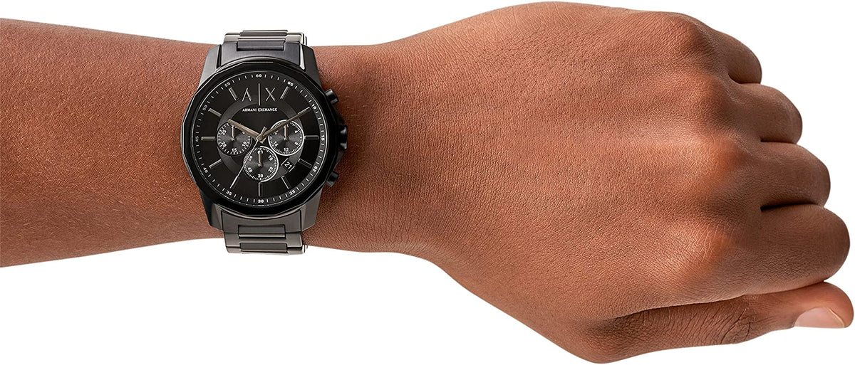 Armani Exchange Banks chronograph watch worn on wrist, displaying black dial and steel bracelet