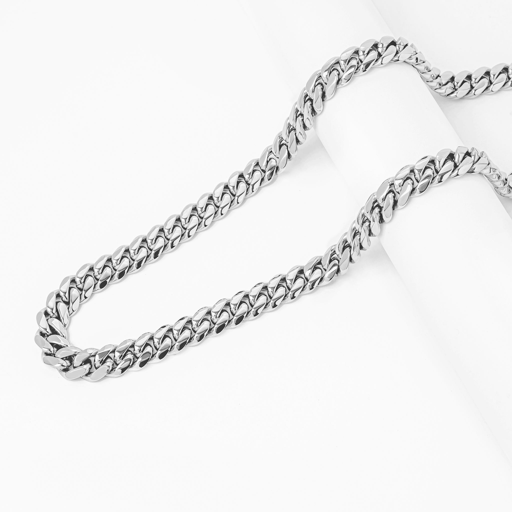 Big Daddy 10MM Cuban link chains arranged in layered display