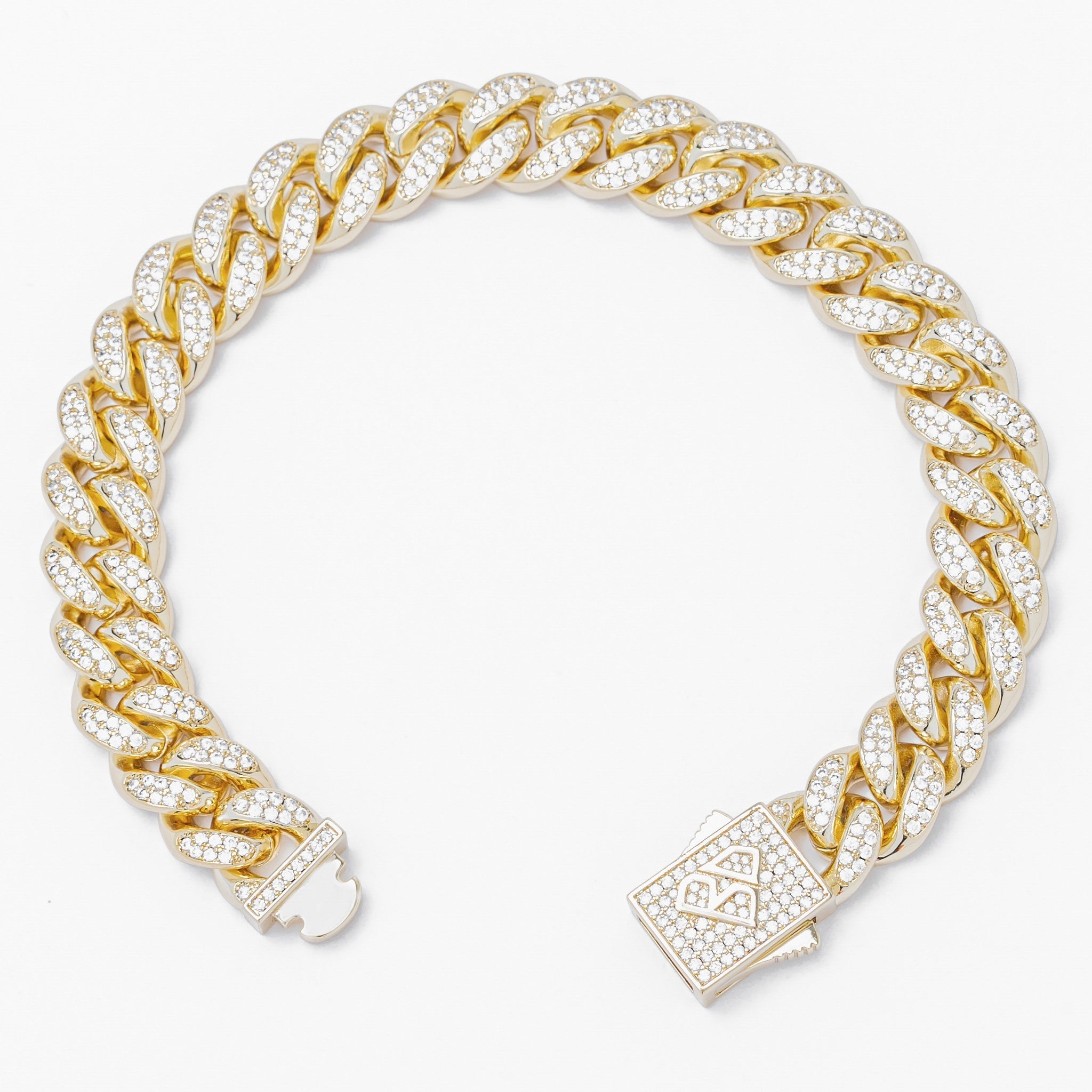 Gold Cuban link bracelet displayed at angle showing cubic zirconia-encrusted links and clasp