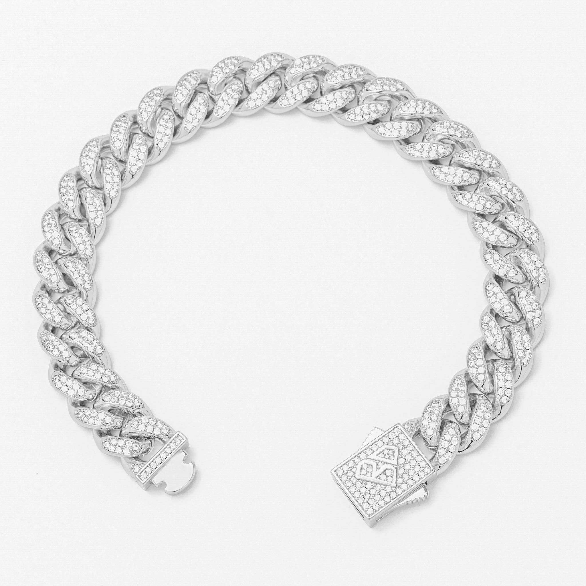 Silver cubic zirconia iced Cuban link bracelet shown from side angle with pave box clasp