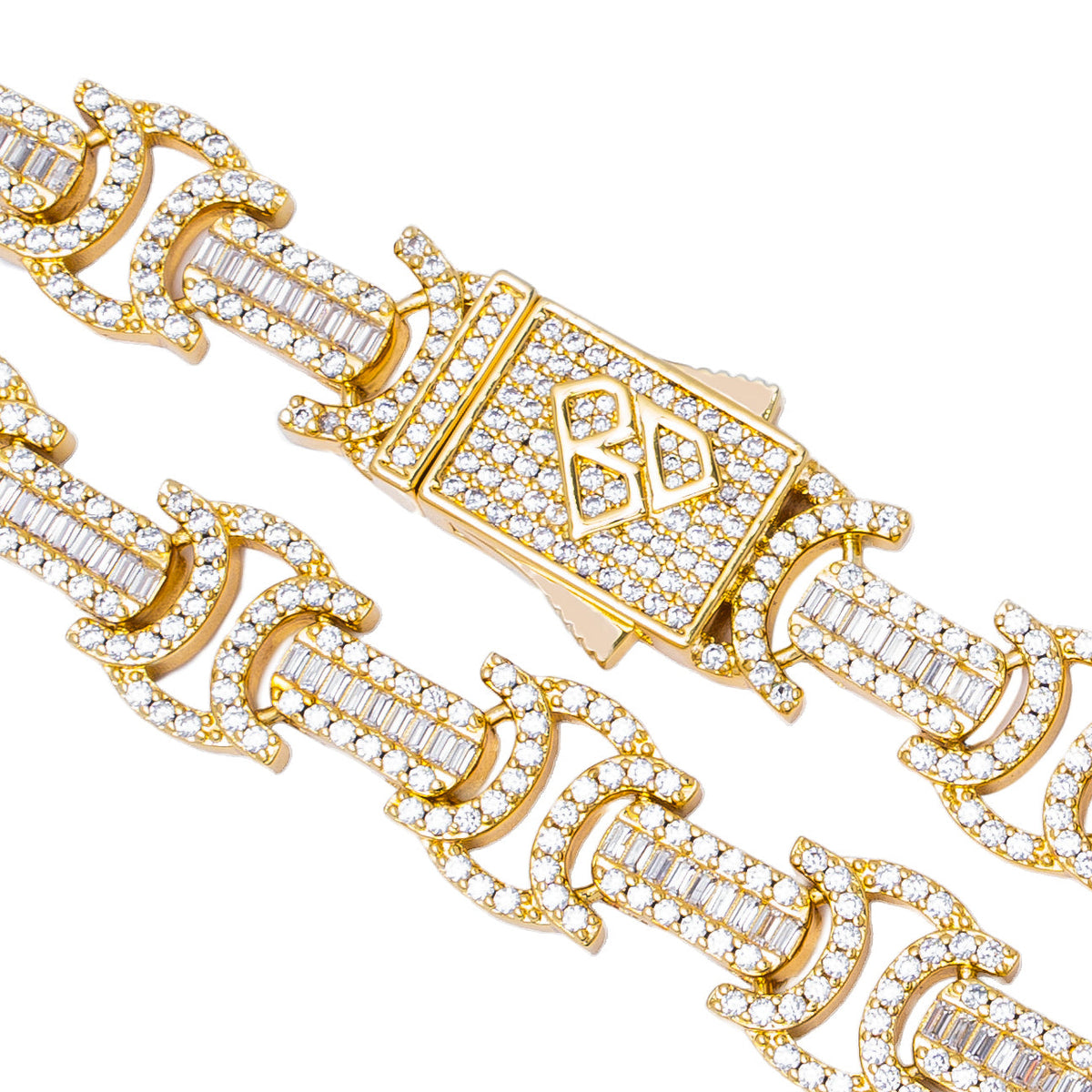 Close-up detail of Byzantine chain links and gold clasp with baguette and round crystal settings