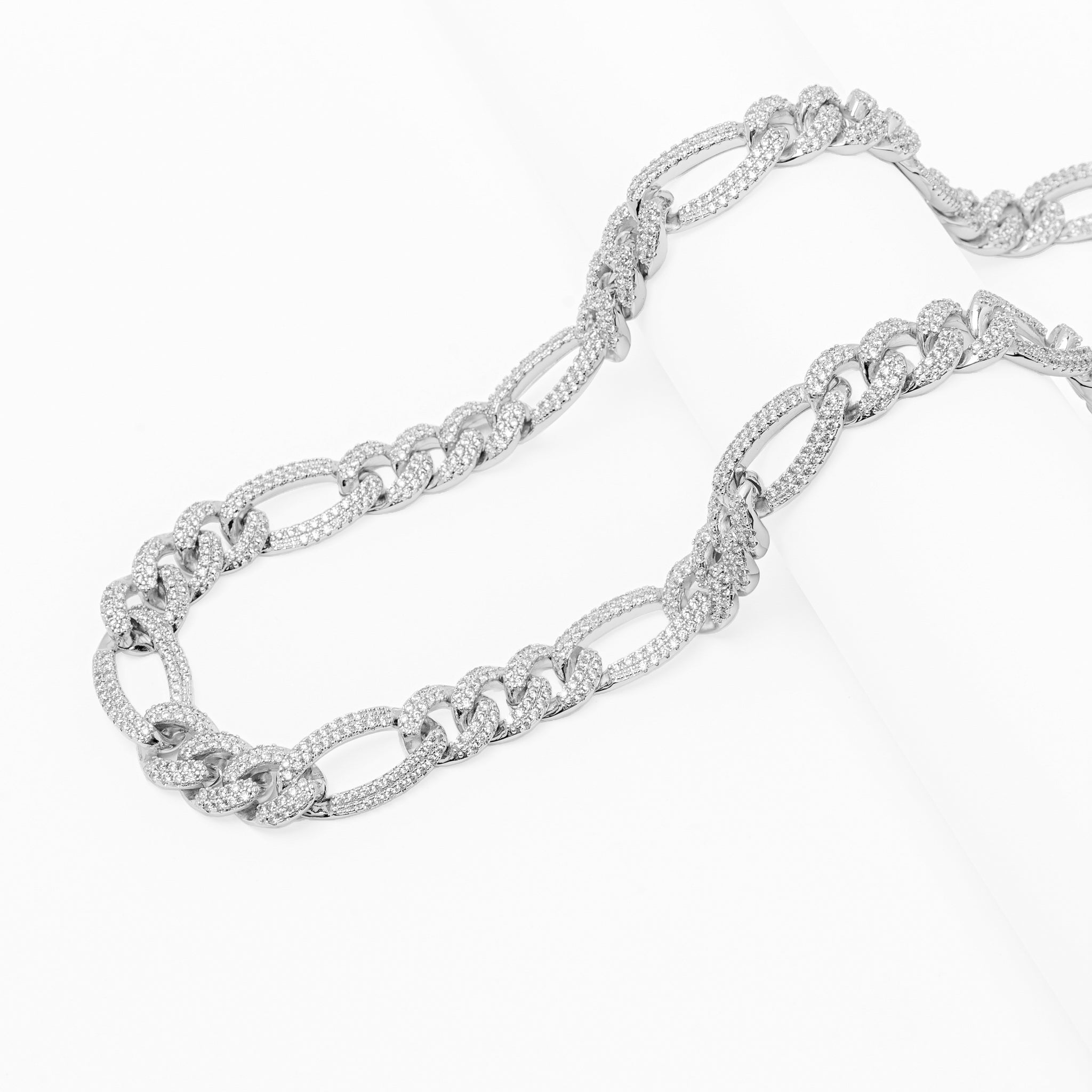 Fully iced figaro chain necklace laid flat showing complete crystal coverage
