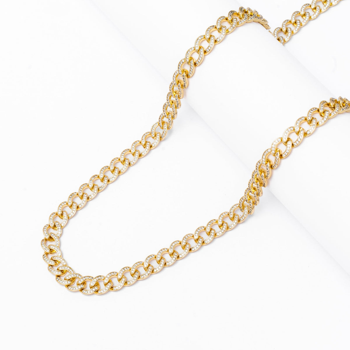 Two 8MM iced Cuban gold chains laid out showing full length and link pattern