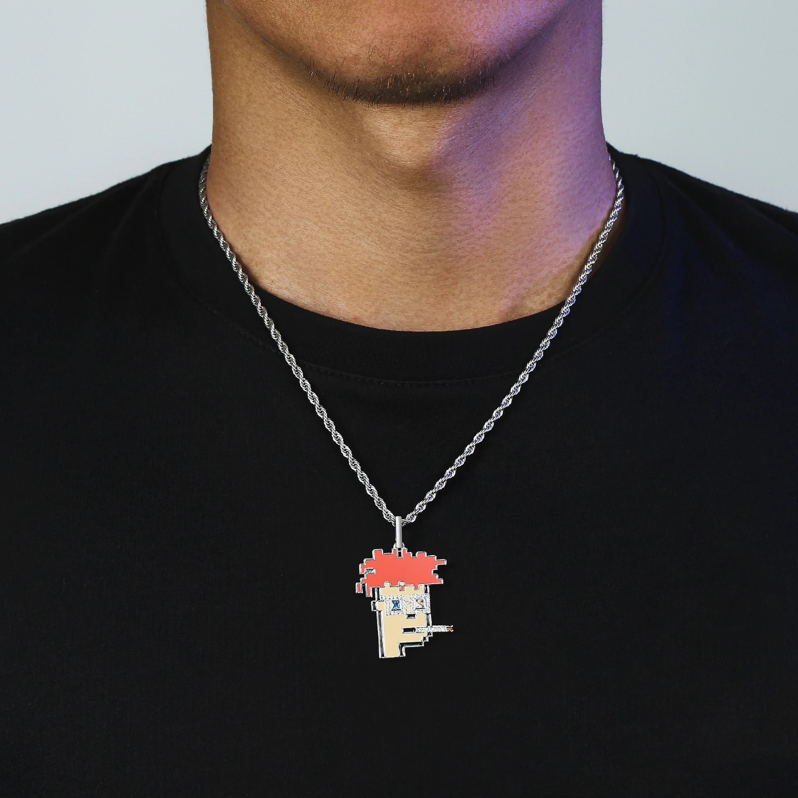 Big Daddy Cryptopunk pendant worn on silver chain around person's neck against black shirt