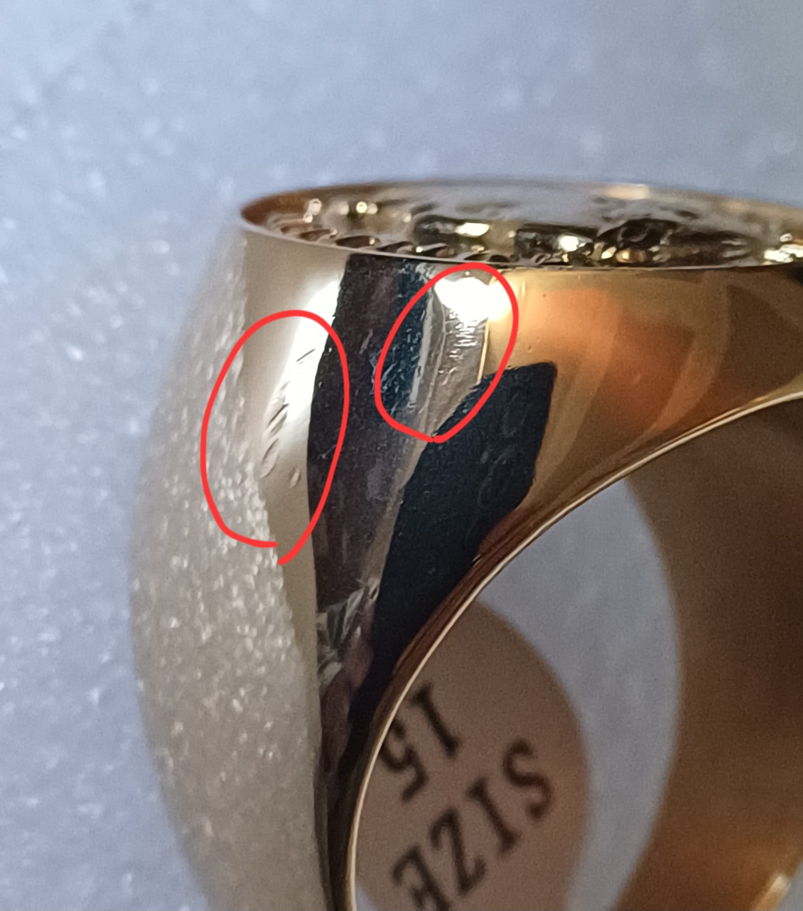 Ring side view with defect areas highlighted in red circles