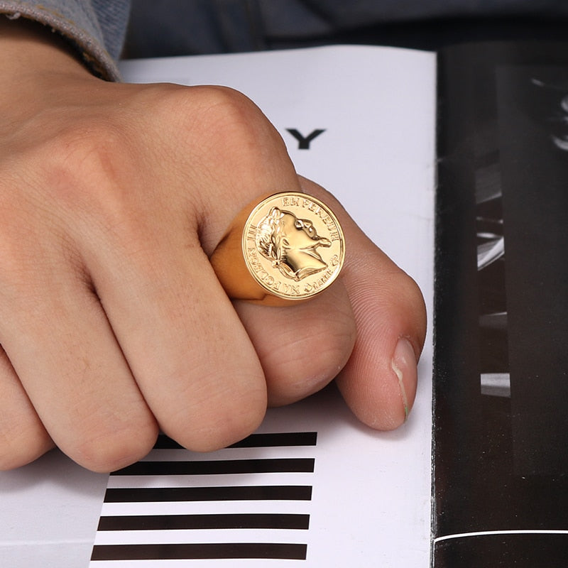 Gold Headhunter Sovereign coin ring worn on finger, showing coin face detail
