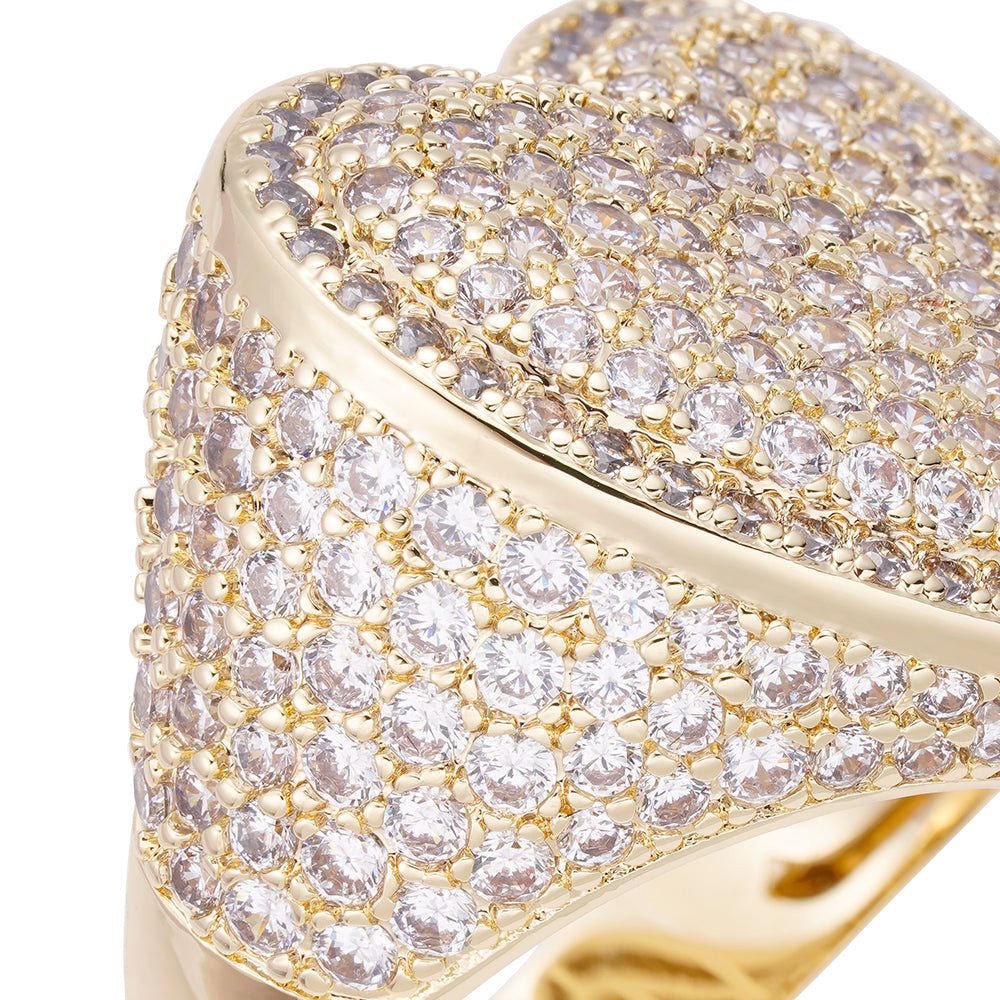 Close-up detail of cubic zirconia crystals and gold setting on heart ring