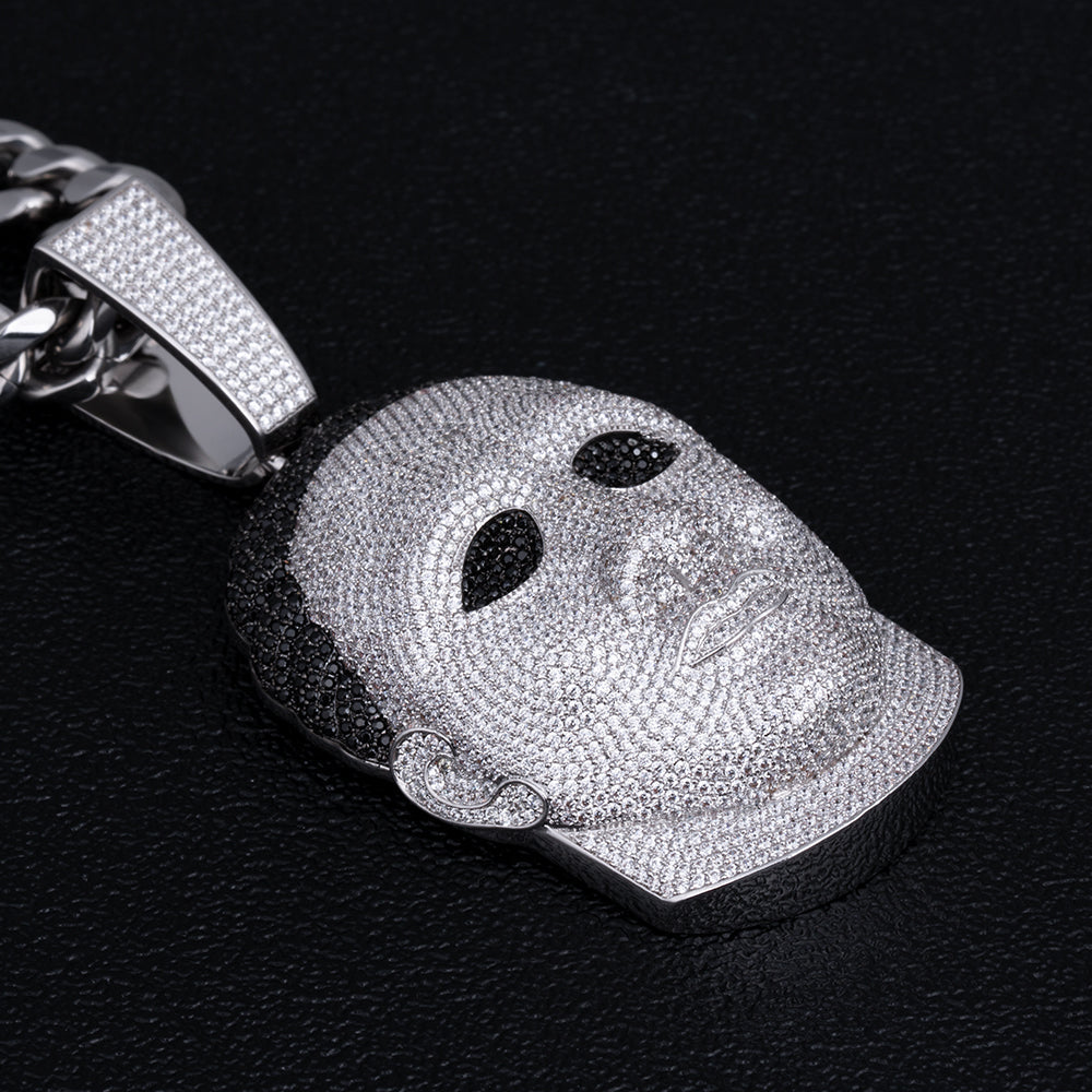 Side angle view of iced Michael Myers mask pendant with silver chain detail