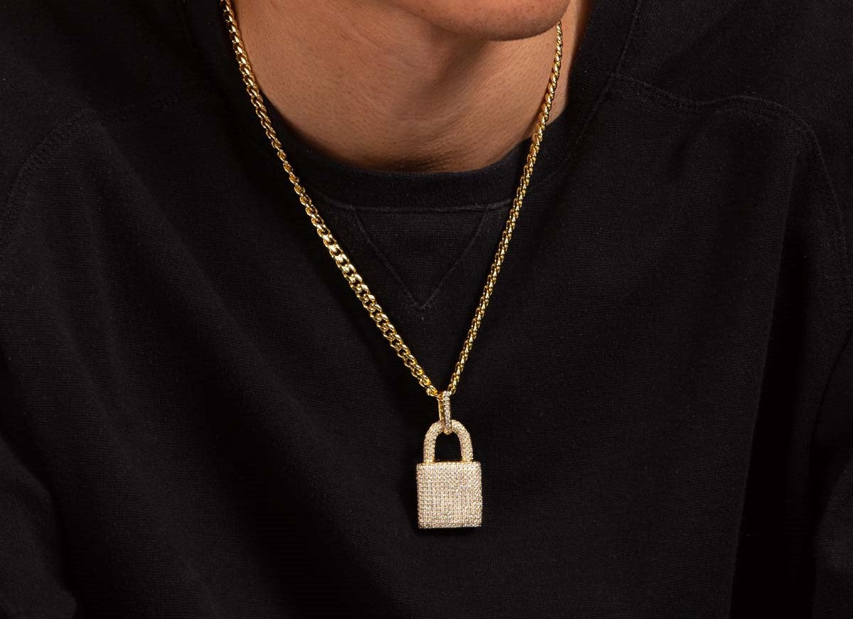 Big Daddy gold lock pendant worn on chain around neck
