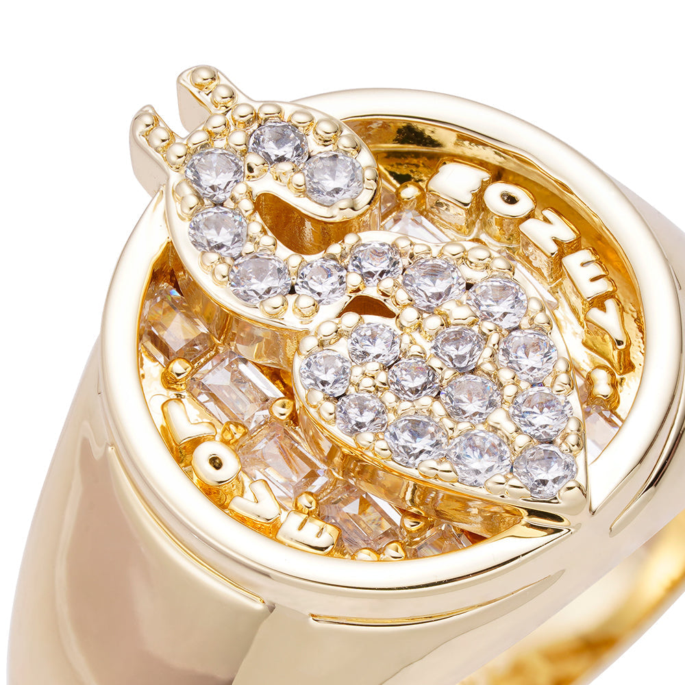 Close-up angled view of Love Money ring showing diamond iced out bezel and filigree gold interior