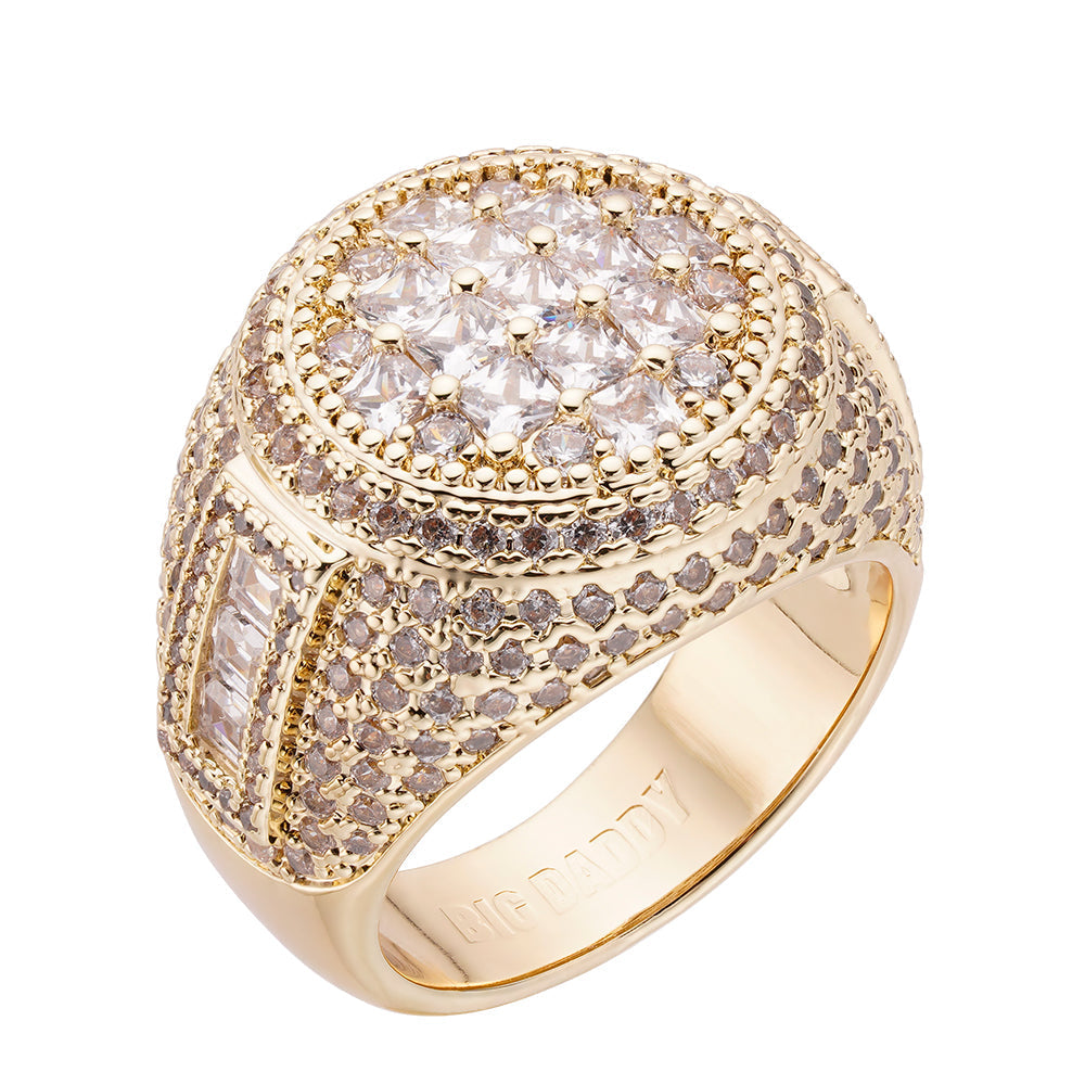 Gold iced out ring with oval baguette cluster center and embellished band
