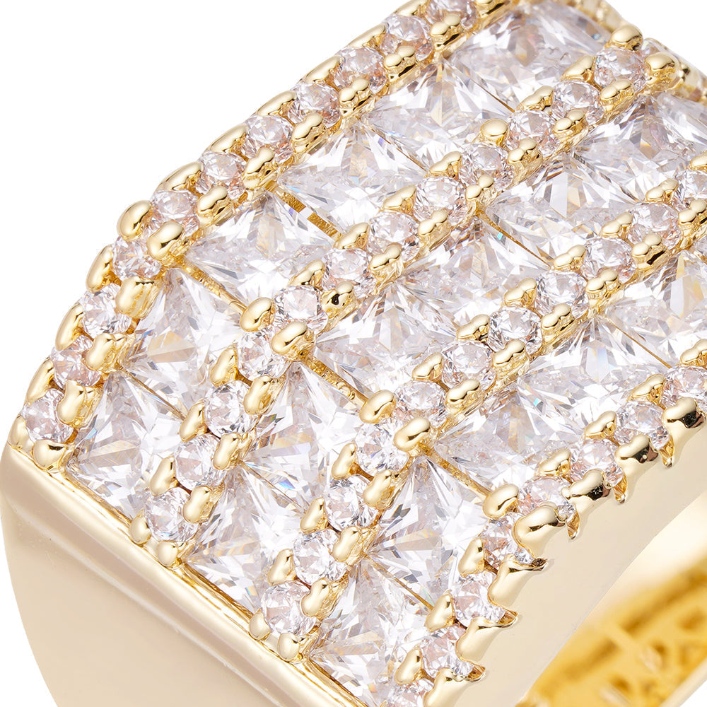 Close-up detail of crystalline stones and gold-tone prong settings on ring