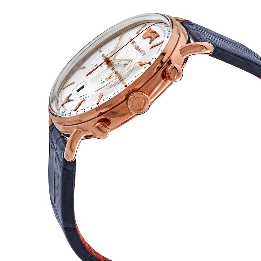 Side angle view of rose gold chronograph case with navy leather strap and red backing