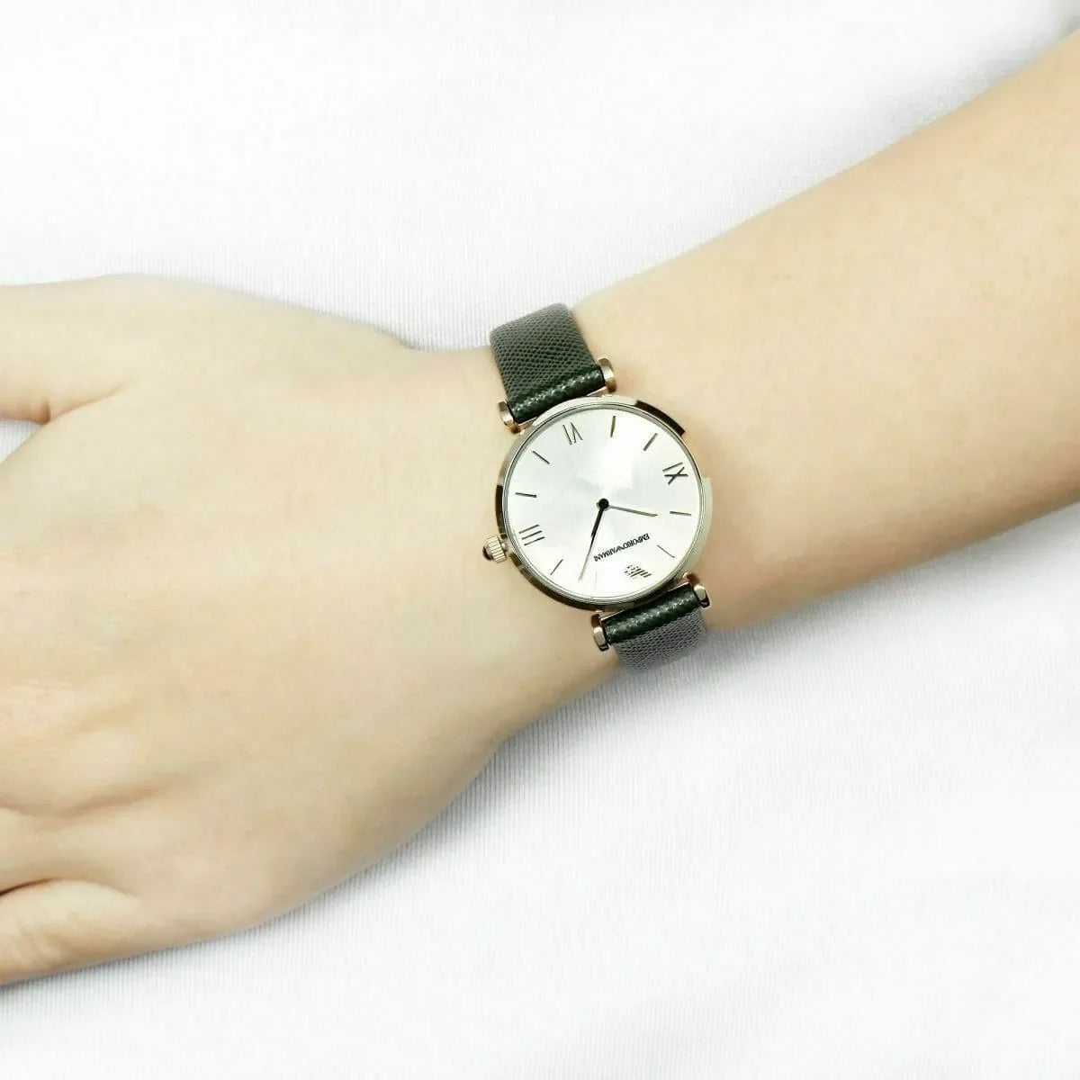 Emporio Armani Gianni AR1726 gold watch worn on wrist with green leather strap