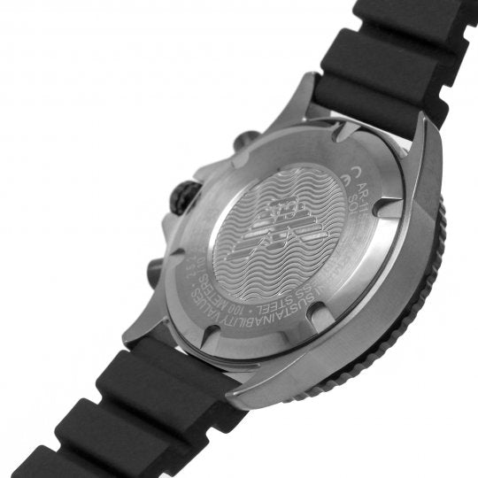 Case back of Emporio Armani Mario watch showing wave pattern engraving and silicone strap