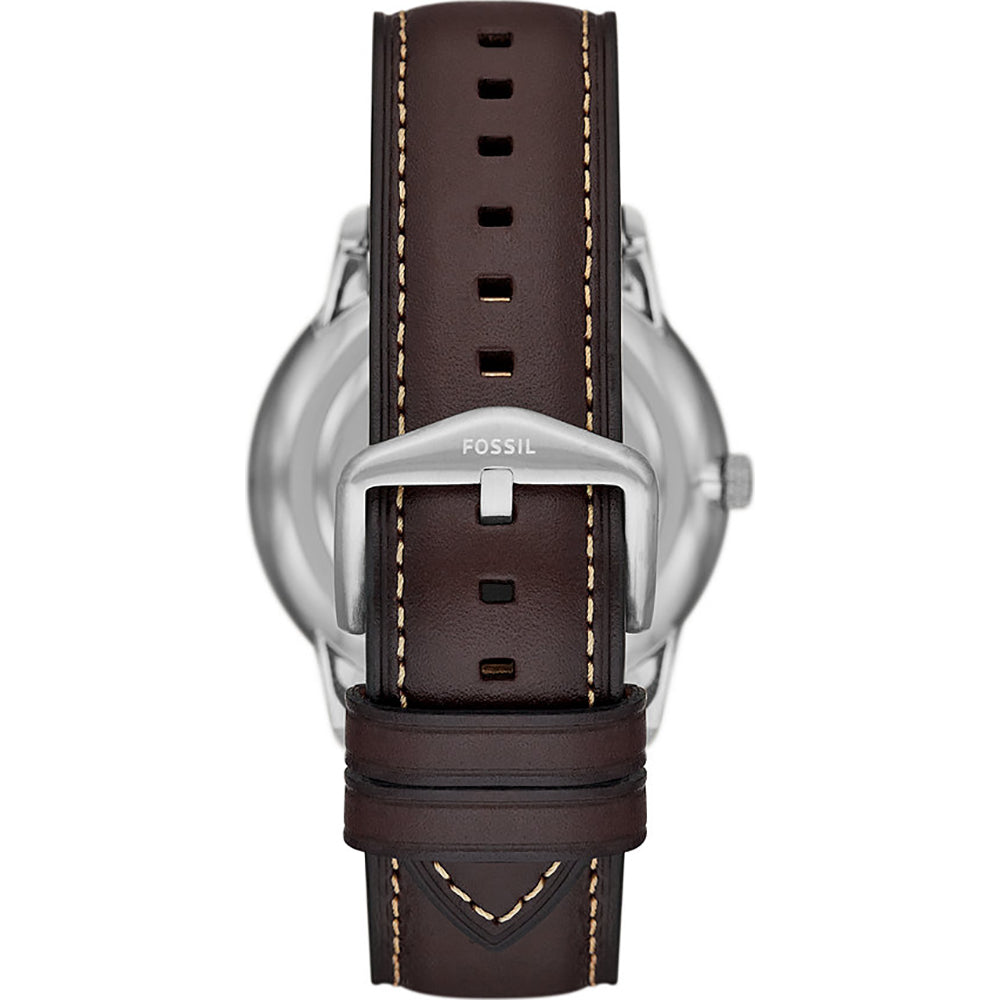 Caseback view of Fossil Neutra moonphase watch with silver case and brown leather strap with stitching