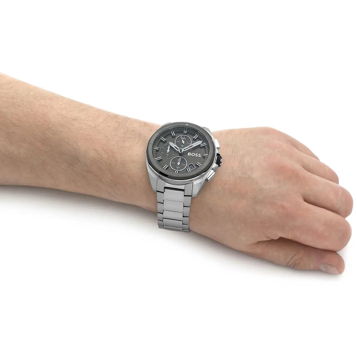 Hugo Boss chronograph watch worn on wrist showing silver case and green dial