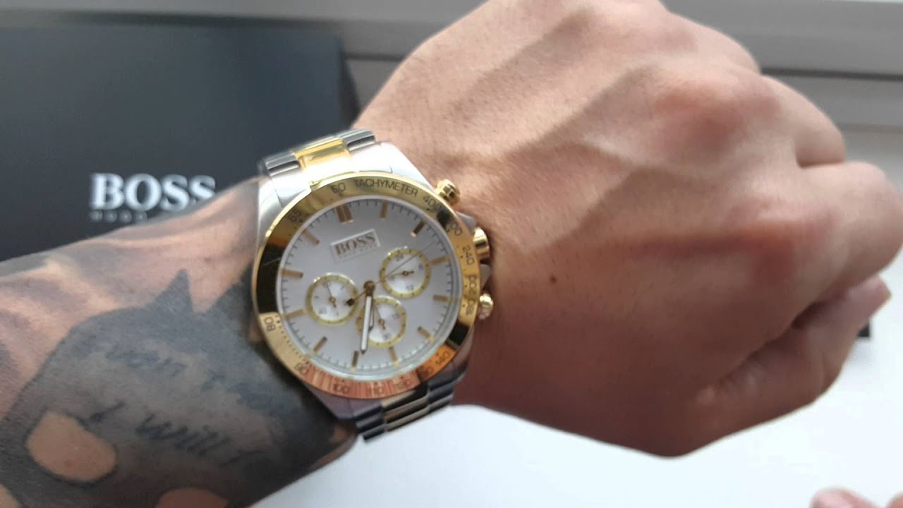 Hugo Boss chronograph watch worn on wrist showing two-tone gold and steel design