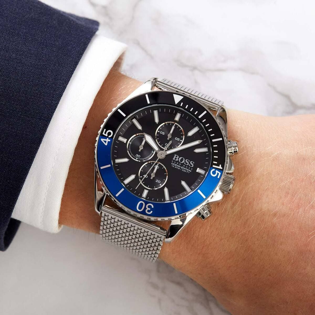 Hugo Boss Ocean Edition chronograph worn on wrist showing dial and blue bezel