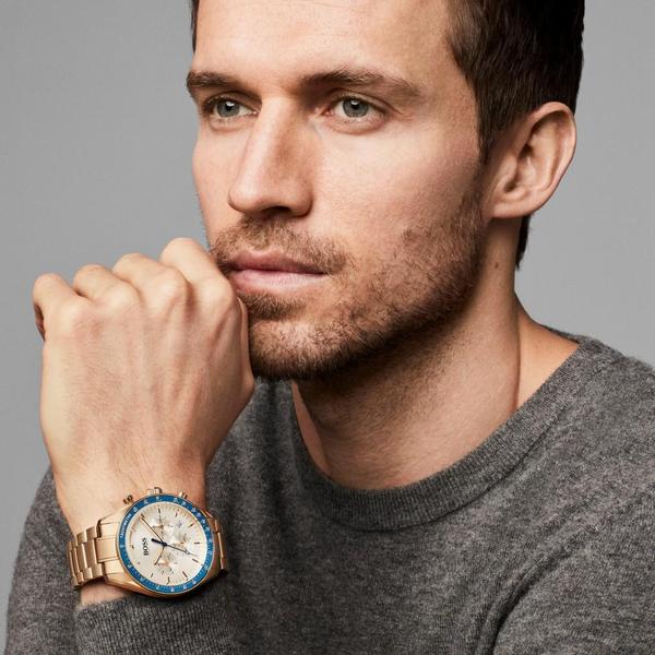 Hugo Boss Trophy chronograph watch worn on wrist, gold tone with blue bezel