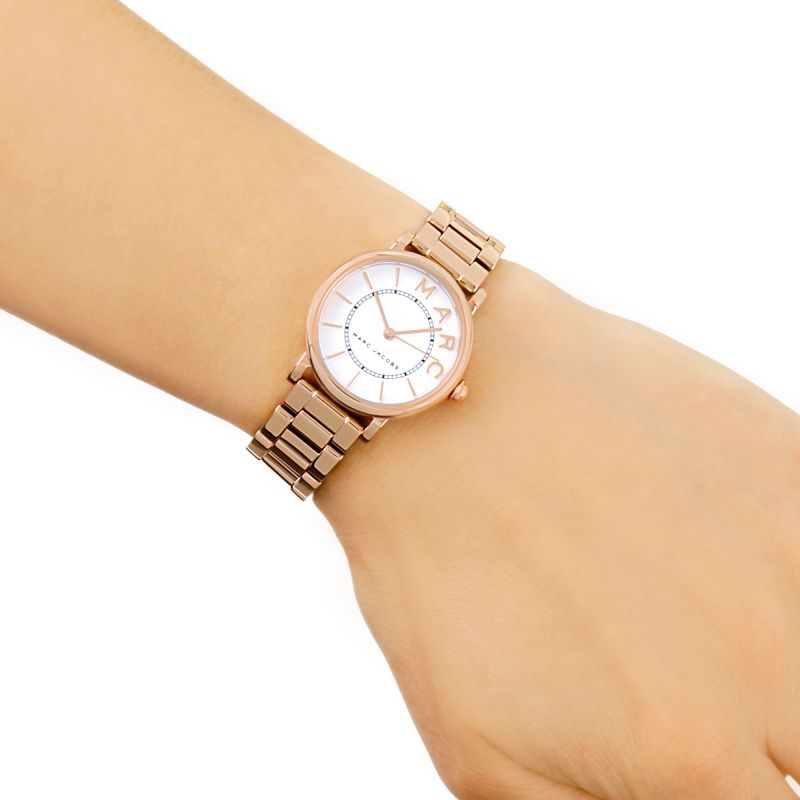 Marc Jacobs MJ3527 rose gold watch worn on wrist displaying white dial and strap