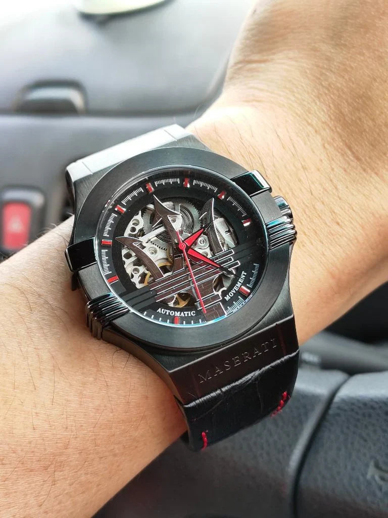 Maserati R8821108008 automatic skeleton watch worn on wrist showing black case and dial