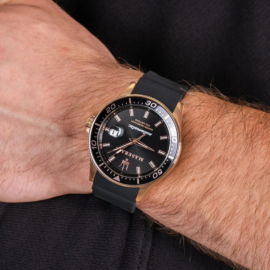 Maserati Sfida men's watch on wrist showing black dial and rose gold bezel