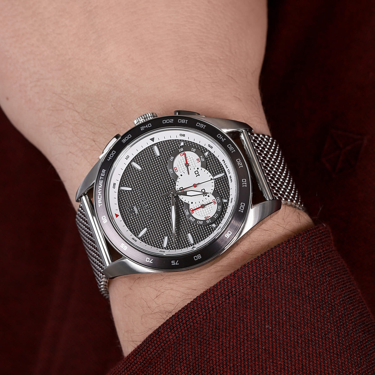 Maserati Traguardo chronograph watch on wrist showing dial detail and steel mesh strap