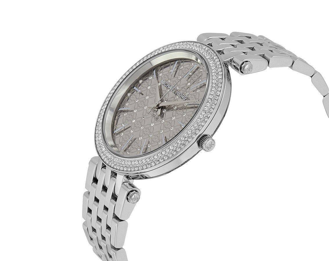 Michael Kors Darci watch angled view showing crystal bezel and bracelet