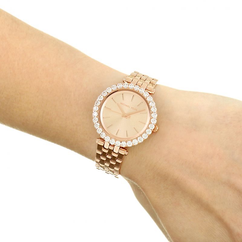 Michael Kors Darci watch worn on wrist showing rose gold dial and crystal bezel