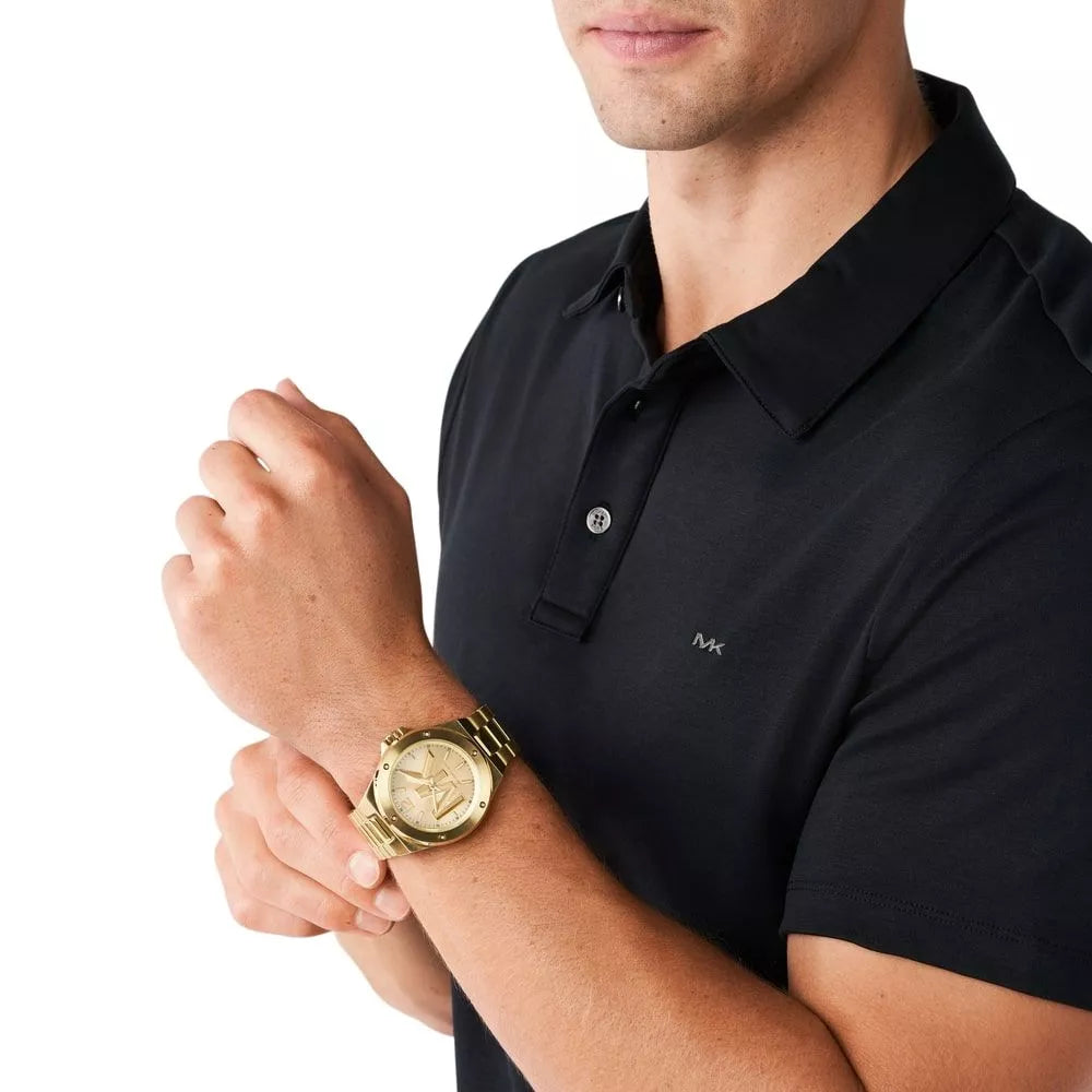 Michael Kors Lennox gold-tone watch worn on man's wrist
