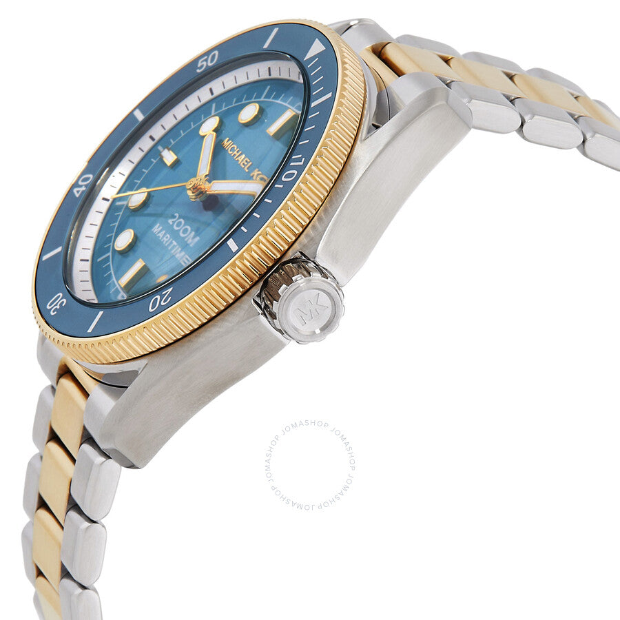 Michael Kors Maritime watch angled view showing blue dial, fluted gold bezel, and two-tone bracelet