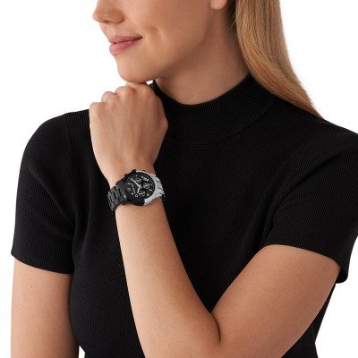 Michael Kors MK7433 Runway watch worn on wrist with black dial and two-tone bracelet