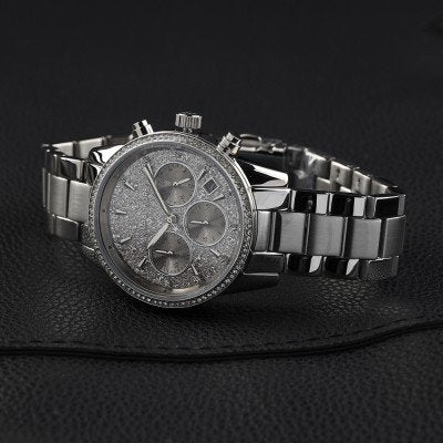Angled view of Michael Kors Ritz MK7301 silver chronograph watch with diamond bezel