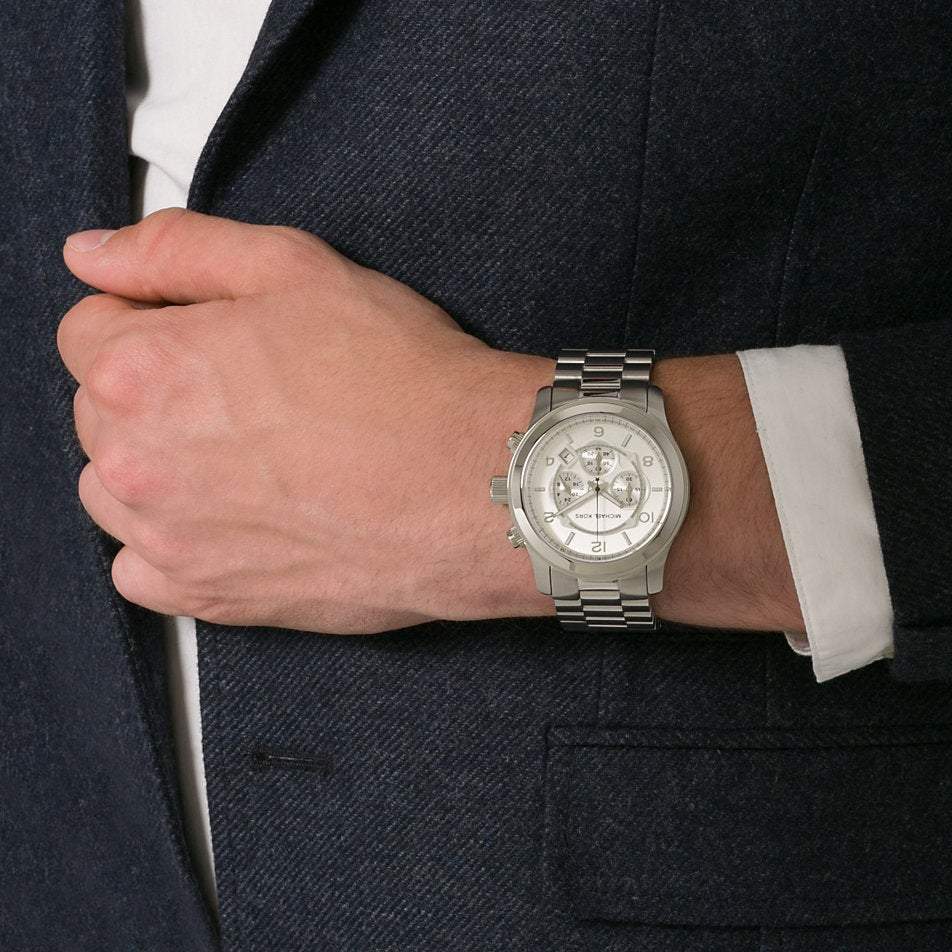 Michael Kors Runway chronograph watch worn on wrist, displayed with navy blazer and white shirt