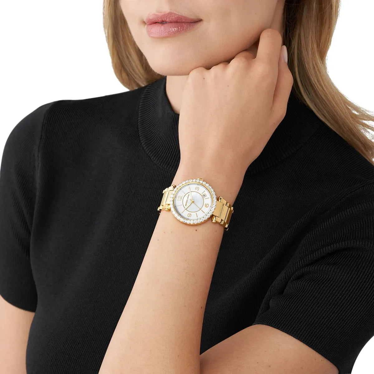Michael Kors Parker Lux rose gold women's watch worn on wrist with white dial and crystal bezel