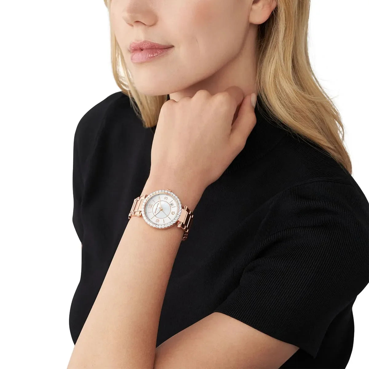 Michael Kors Parker women's watch worn on wrist with white MOP dial and rose gold case