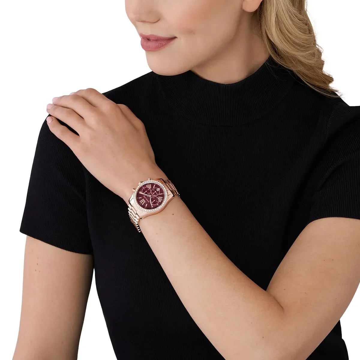 Michael Kors Lexington Lux chronograph watch worn on wrist with burgundy dial and rose gold bracelet