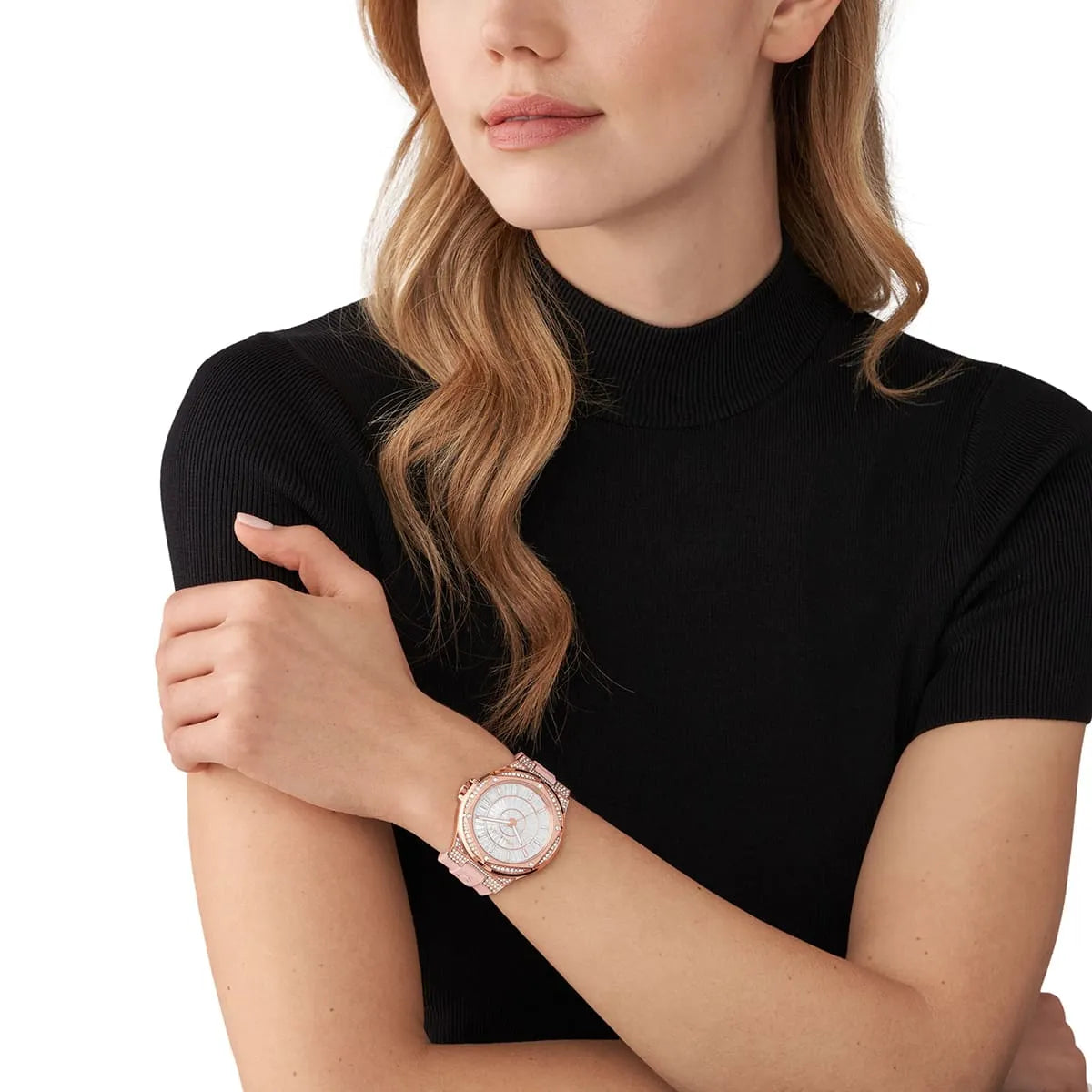 Michael Kors Lennox watch worn on wrist showing rose gold case and white dial