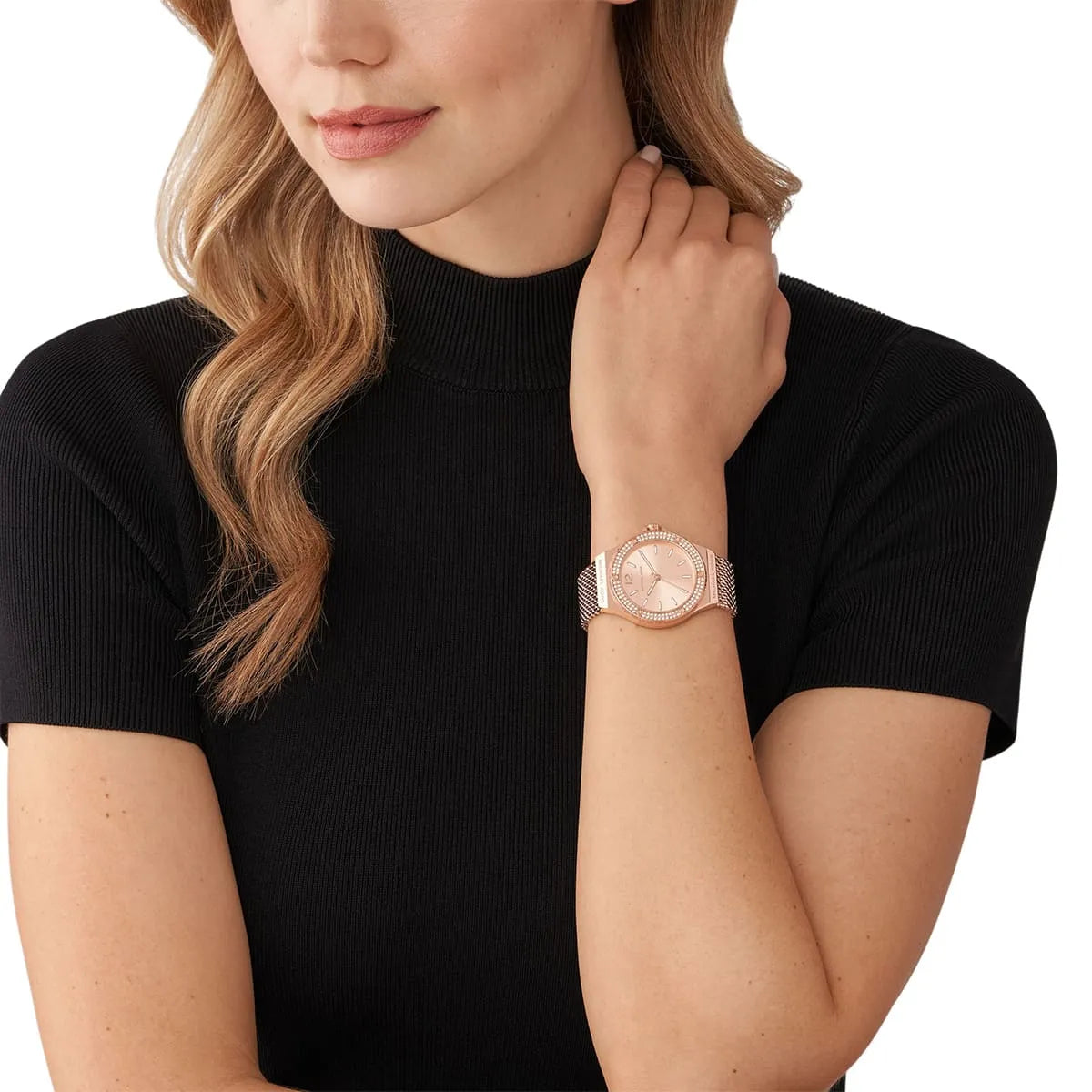 Michael Kors Lennox watch worn on wrist showing rose gold case and mesh band