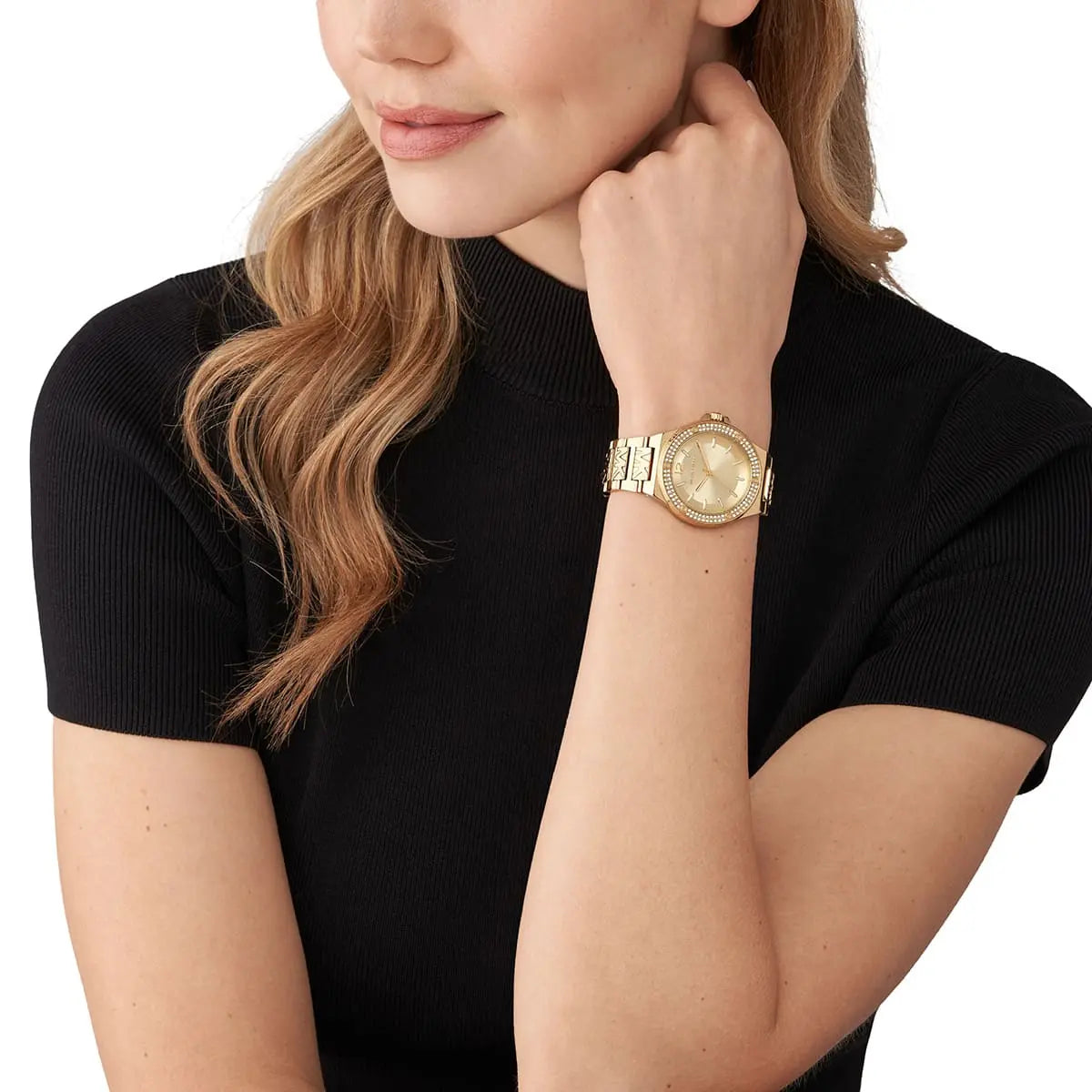 Michael Kors Lennox gold women's watch worn on wrist