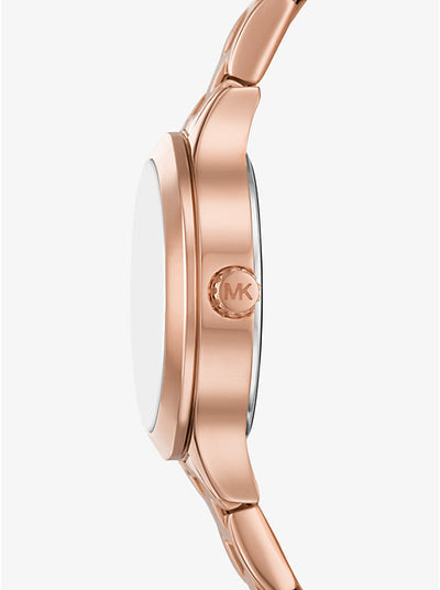Michael Kors Mini Aspyn watch side profile showing rose gold case and MK logo detail