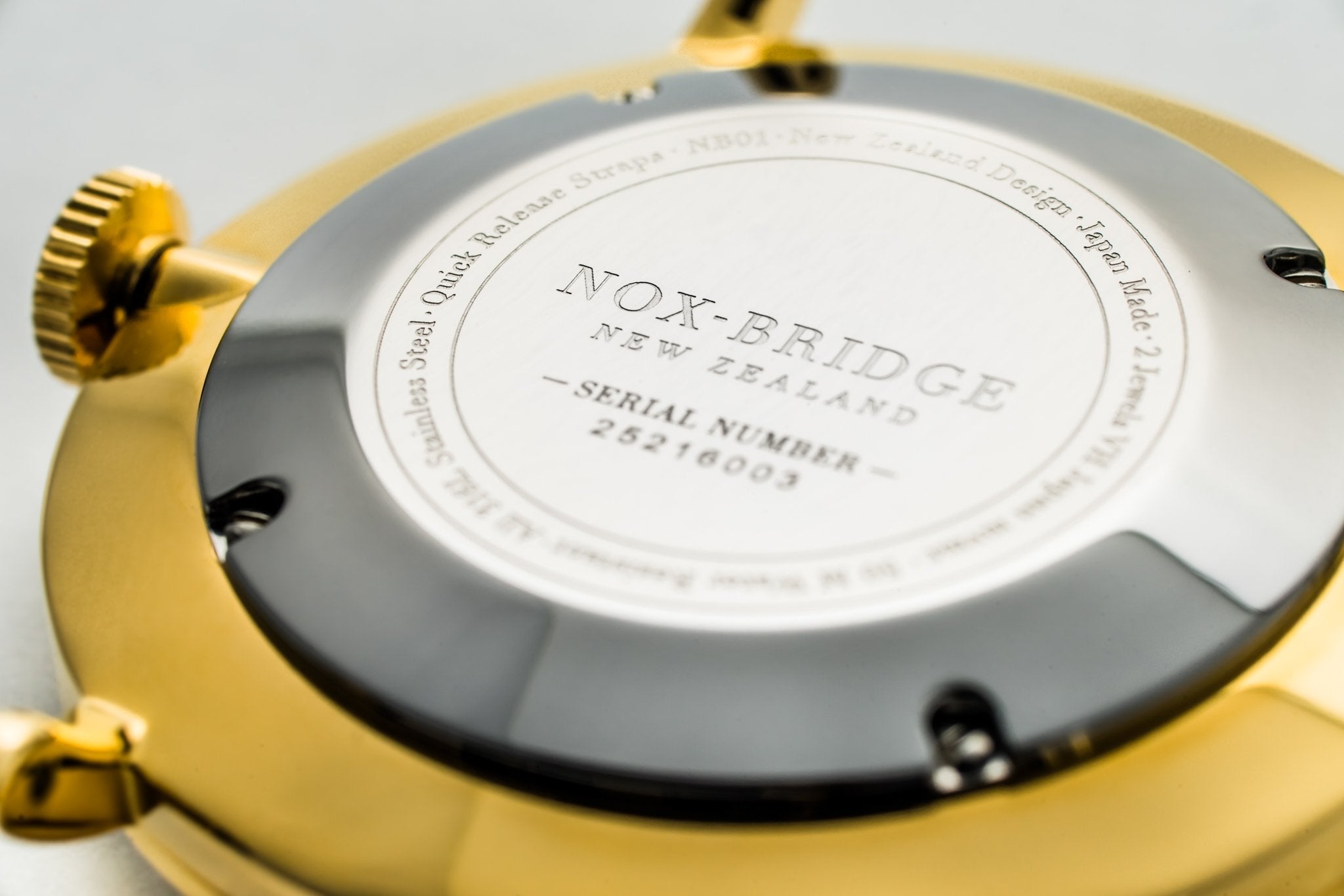 Caseback of Noxbridge Capella watch displaying engraved text and serial number