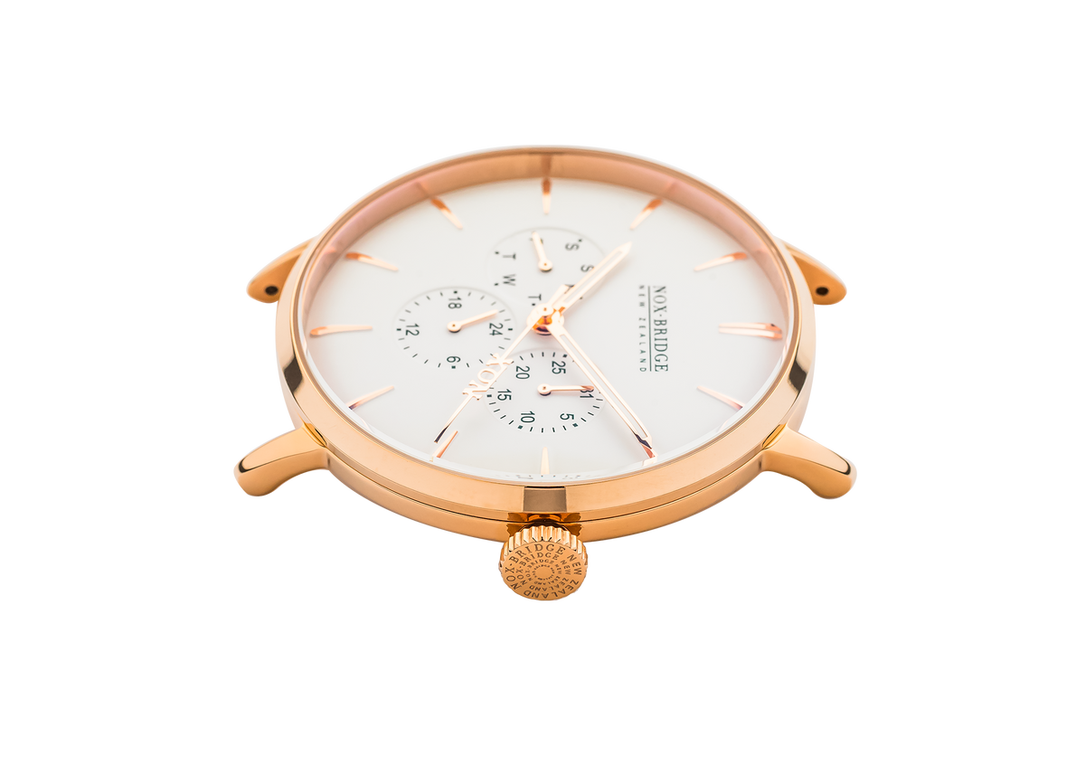 Top-down angle view of Noxbridge Classic Capella rose gold chronograph watch with white dial