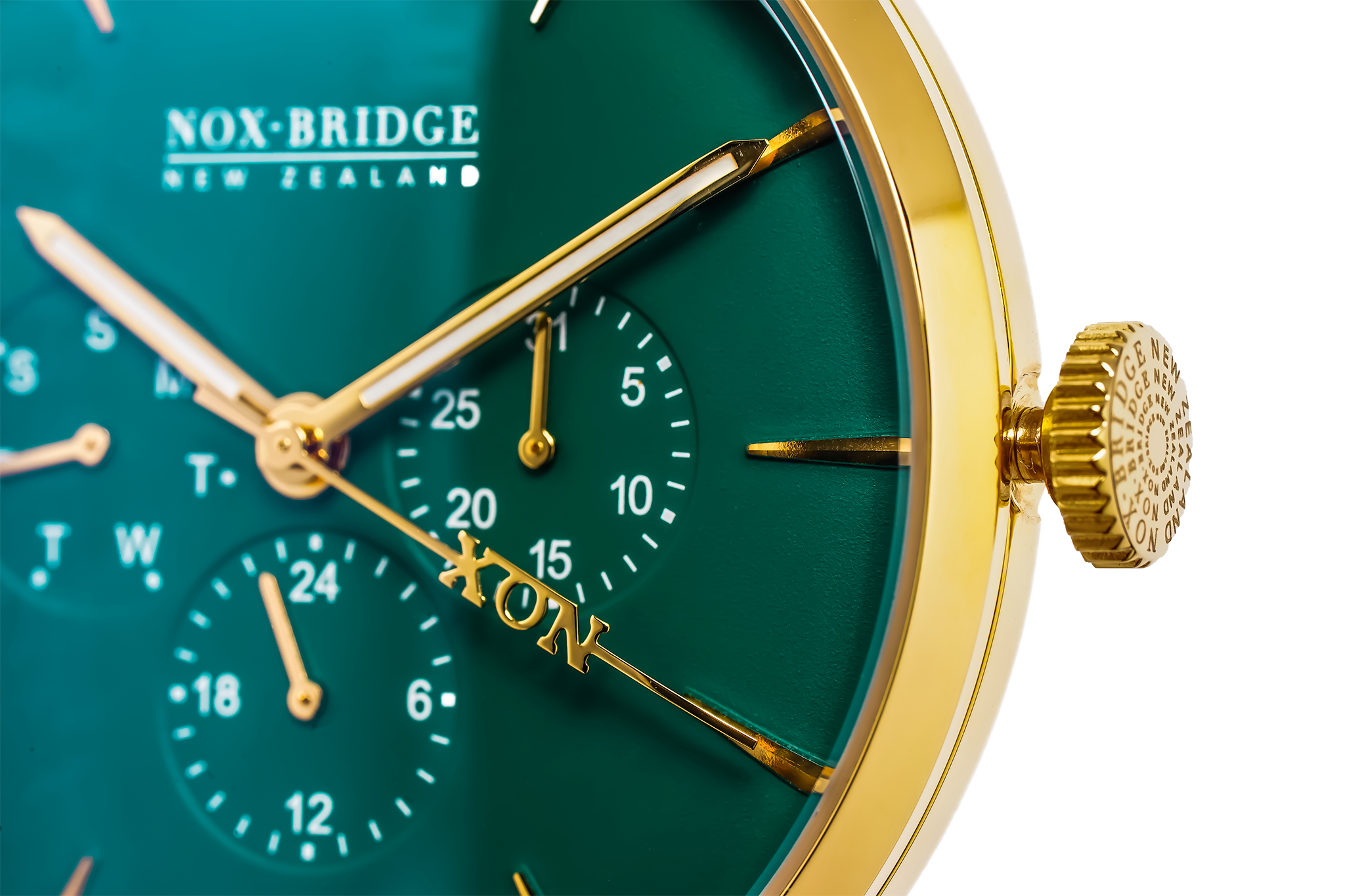 VG36 dial detail showing chronograph subdials, gold hands, and green face