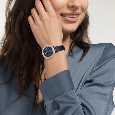Crystal Frost women's watch worn on wrist with blue sunray dial and crystal bezel visible