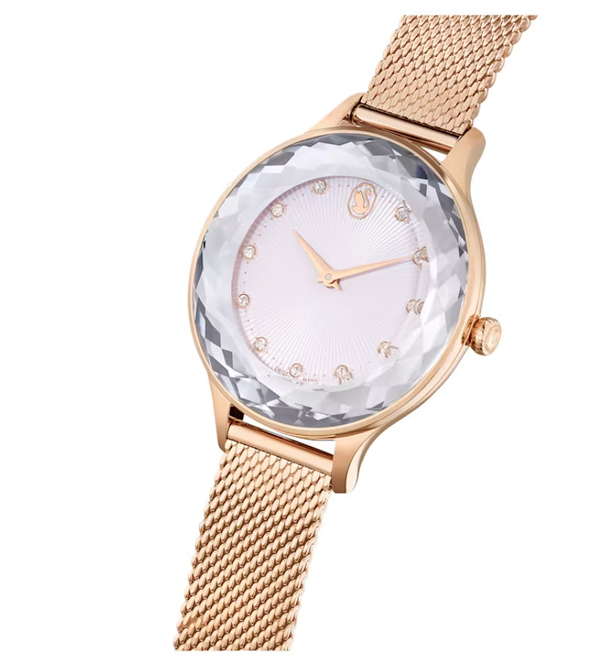 Angled view of Swarovski Dextera watch showing crystal pave bezel and rose gold mesh strap detail