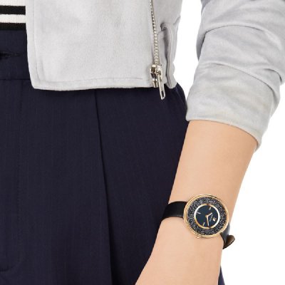 Swarovski Graceful Lady rose gold women's watch worn on wrist with dark strap