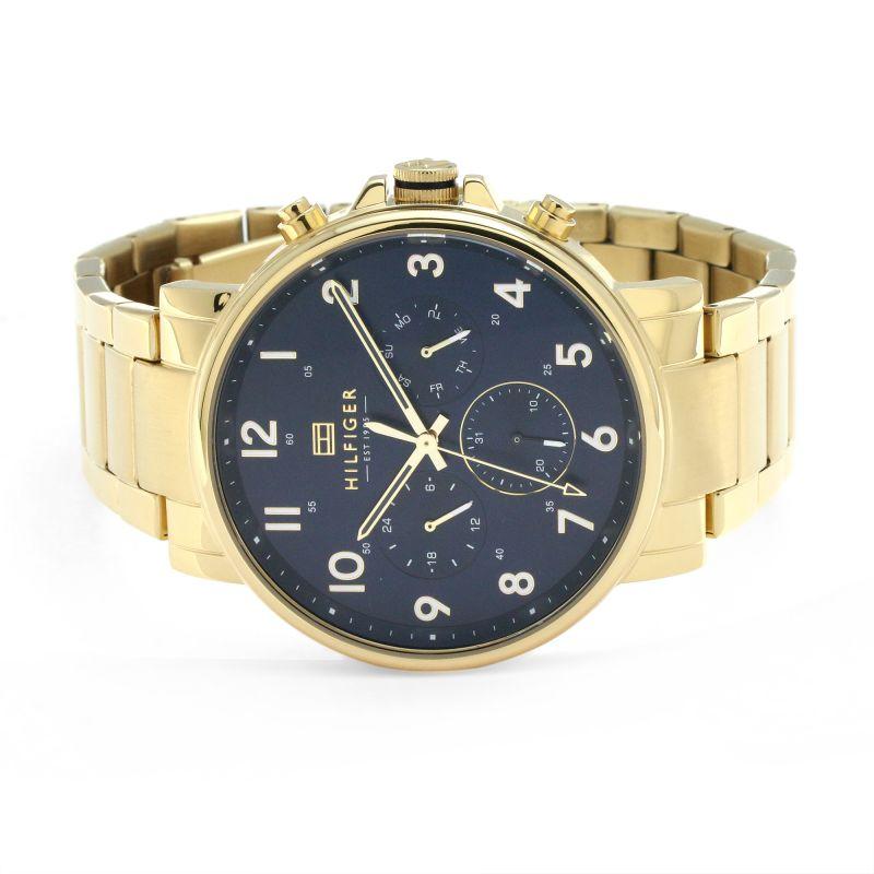 Tommy Hilfiger gold chronograph watch on wrist showing navy dial and case